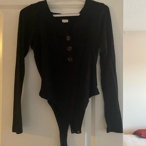 Black bodysuit with brown buttons
